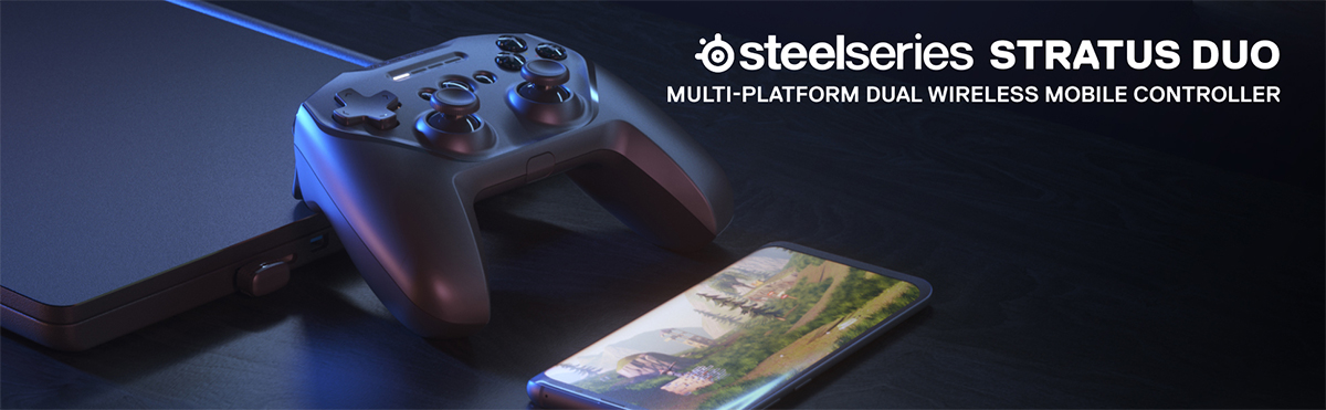 SteelSeries Stratus Duo Stratus Duo bredvid en mobil och en bärbar dator