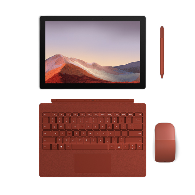 Surface Pro 7 är nästa generations bärbara dator En Surface Pro 7 som ligger platt och som har ett rött tangentbord samt en penna