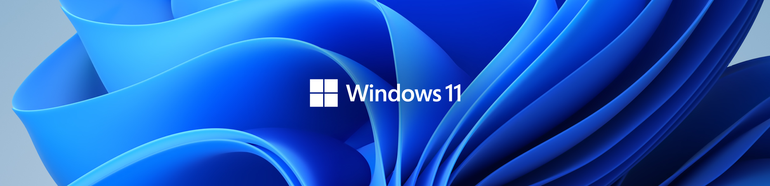 Windows 11 Windows 11-text i vitt framför en livlig, blå bakgrund