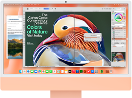 Orange iMac sedd framifrån, skärmen visar en bildredigeringsapp med AI-verktyg och i bakgrunden syns appen Mail