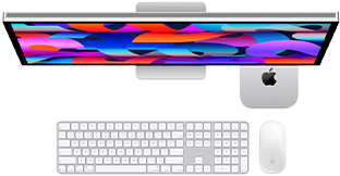 Mac mini under en Studio Display, Magic Keyboard med numerisk del, Magic Mouse