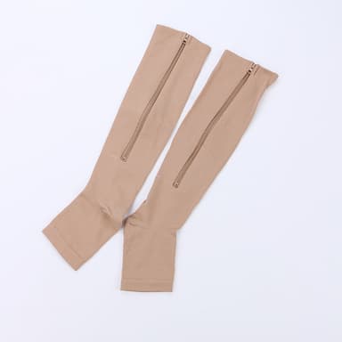 Kompressionsstrumpor med dragkedja och öppen tå i nylon/spandex beige