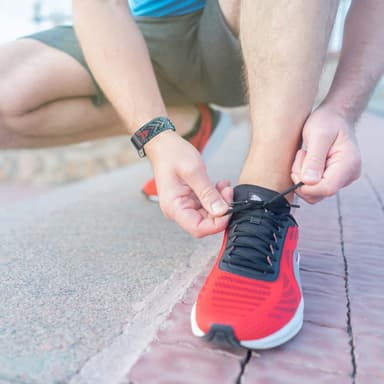 Fitbit Charge 5 armband med flätad mönster Blå/Orange