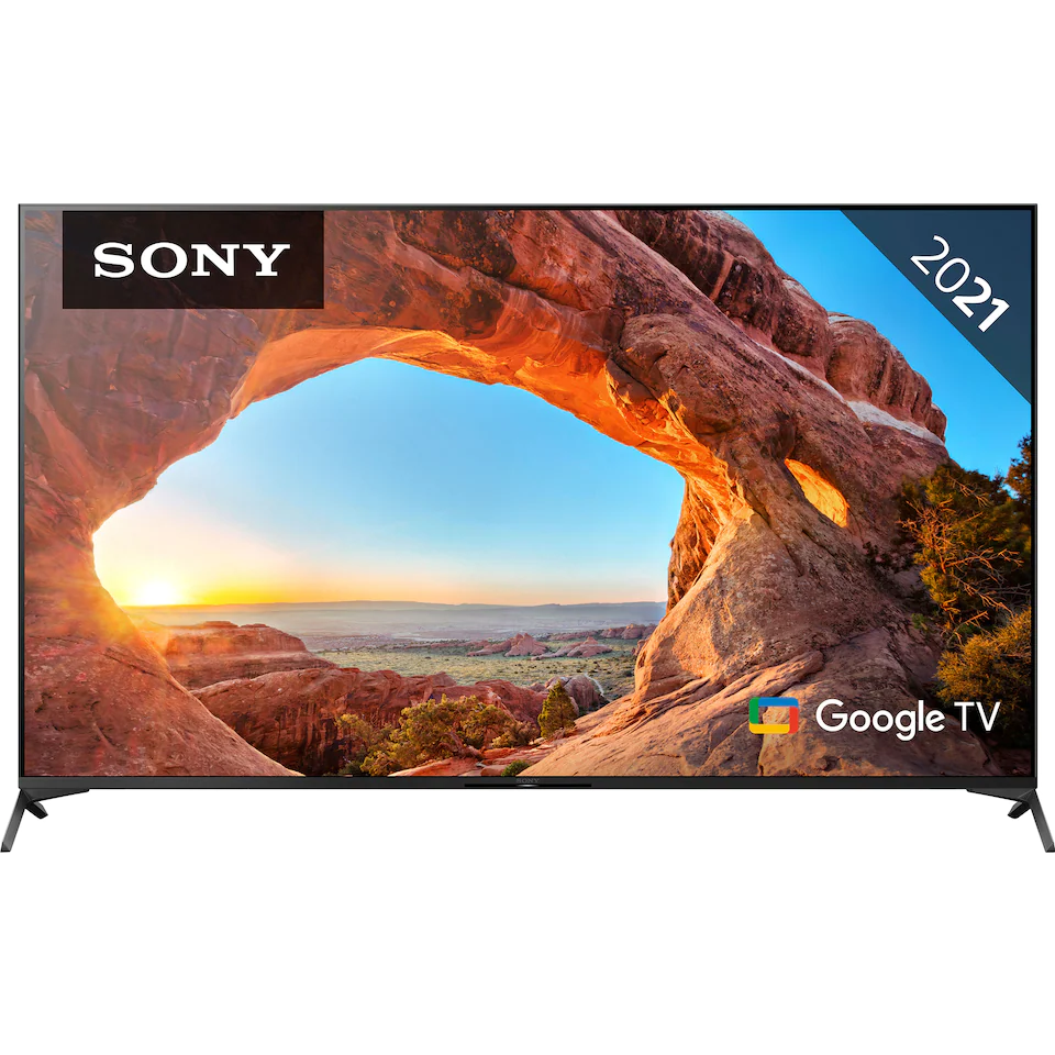 LCD-TV från Sony på stativ med ihålig klippformation som visar solnedgång på skärmen. 