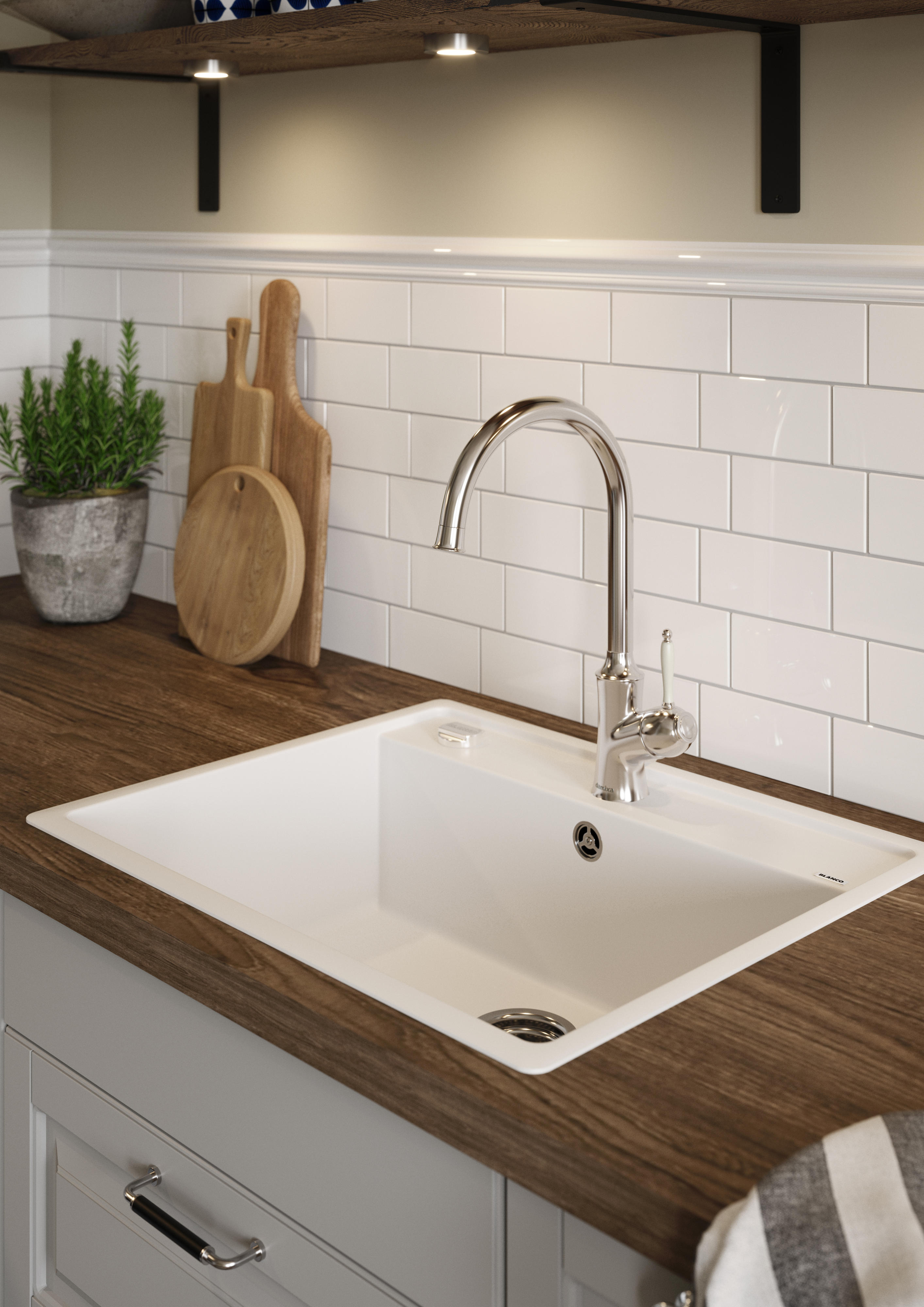 Spots over a white Sink on a wooden laminate worktop in an Epoq Heritage Light Grey kitchen 