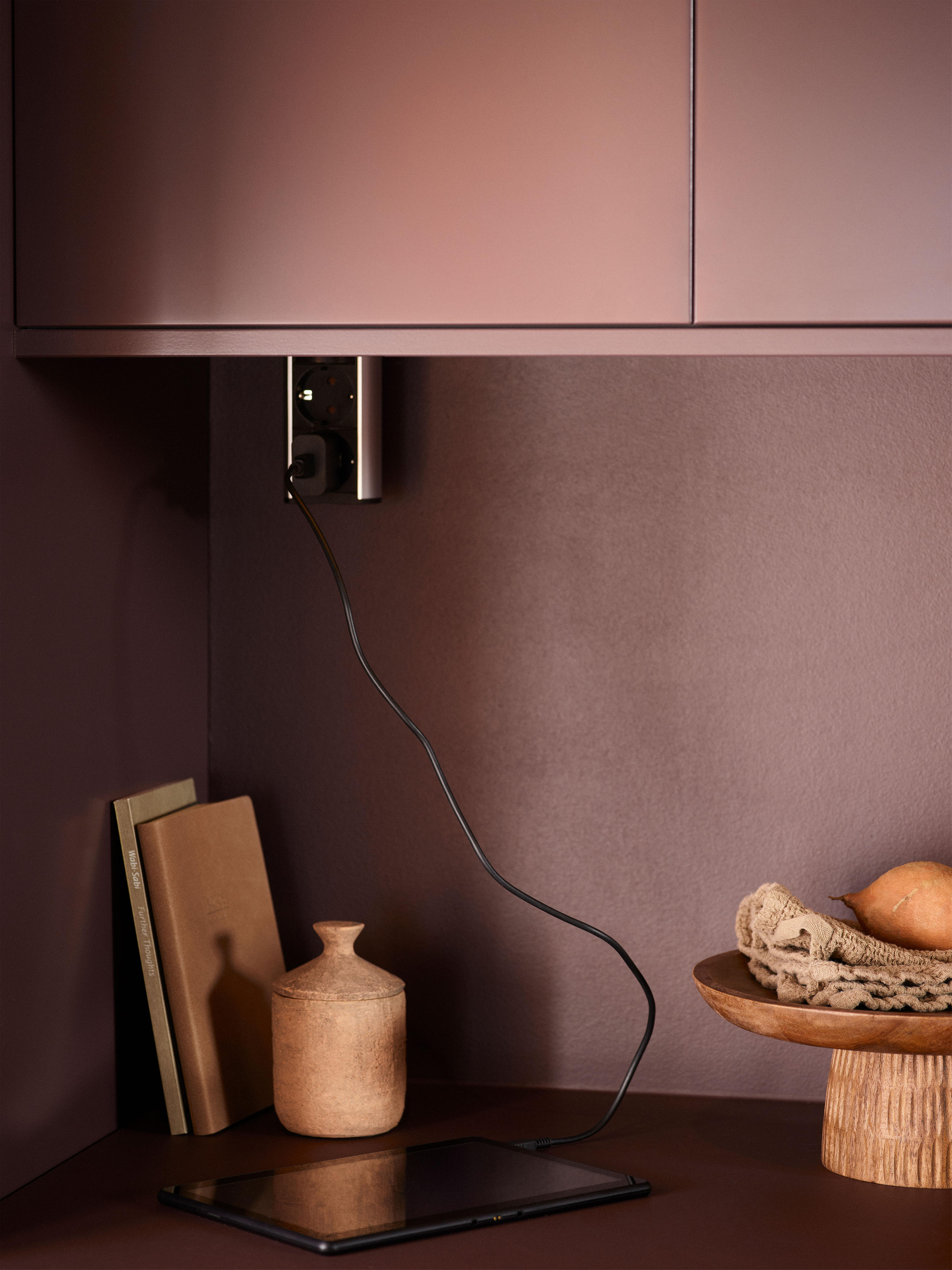 Epoq Trend Burgundy kitchen with cutting boards, electrical outlet, tablet and decorations