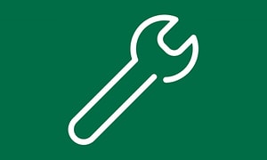 Symbol för kundsupport, vit verktygsnyckel på grön bakgrund. 