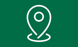 Symbol som visar en vit pin, alltså en plats, på grön bakgrund.