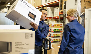 Corporate - Sustainabillity - co-workers in warehouse loading microwaves