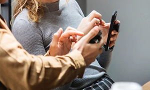 Corporate - Sustainabillity - Two people using their phones