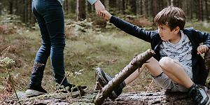 Corporate - Social responsibility - Kid being helped in the woods