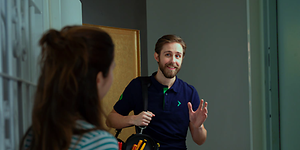 services - home technician - technician being greated by the door