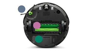 Bild på en iRobot underifrån med olika borstar i grön färg och hjul mm. 