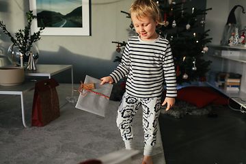 Boy holding Christmas gift