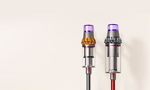 Dyson Outsize Absolute : Två dammsugare bredvid varandra.