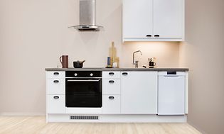 White EPOQ Viva kitchen in an open kitchen solution with integrated oven and cooker hood