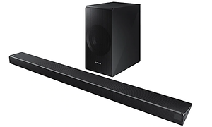 Soundbar med ljudförstärkare helt i svart med vit bakgrund.