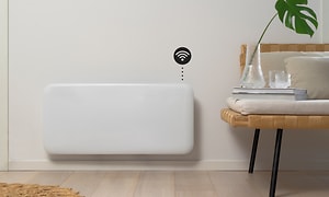 Smart heater on a wall with wifi symbol and interior in front