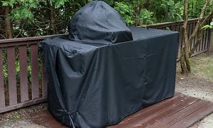 Grillskydd som skyddar en grill från regn