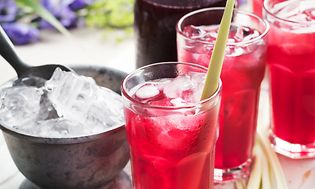 Glasses of lemonade with ice cubes