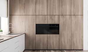 MDA-Oven-Två integrerade ugnar i ett kök med träfronter