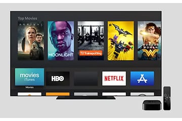Startbild från Apple TV med olika filmer, Netflix logga och HBO med mera.