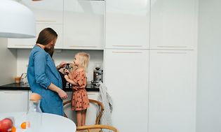 MDA-Fridges-Pregnant woman and little girl standing in a kicthen