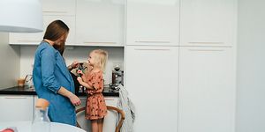 MDA-Fridges-Pregnant woman and little girl standing in a kicthen