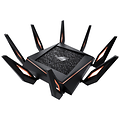 En stor svart gaming router med många antenner. Detaljer i orange färg. 