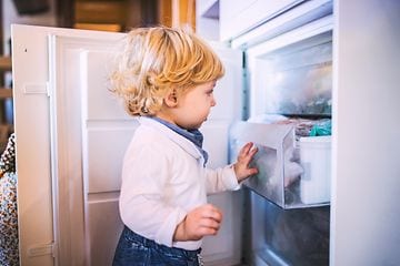 MDA-Freezers-Little boy opening  a freezer