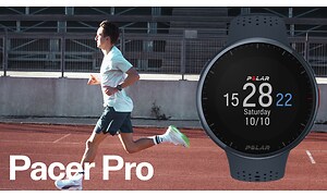 Polar - A Polar Pacer sportswatch on the wrist of runner on a running track
