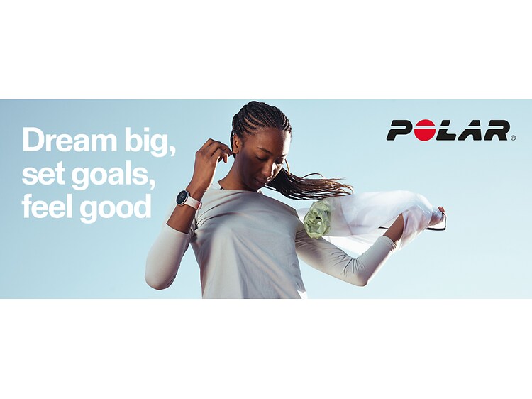 Polar - A Polar Smartwatch on a young woman with the text Dream big set goals feel good