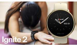 Polar - A Polar Ignite smartwatch on the wrist of woman doing yoga