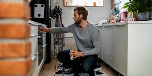 Man checking the oven