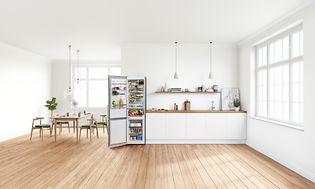 Kitchen with an open fridge freezer from Bosch