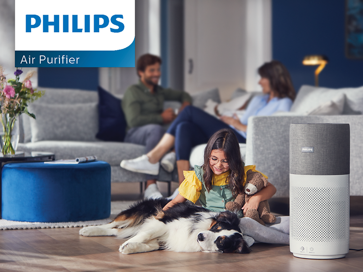 Philips luftrenare intill ett barn och en hund