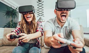 Couple playing video games virtual reality glasses