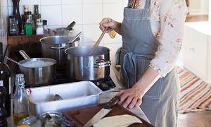 SDA-Cooking-Woman preparing dinner in a kitchen