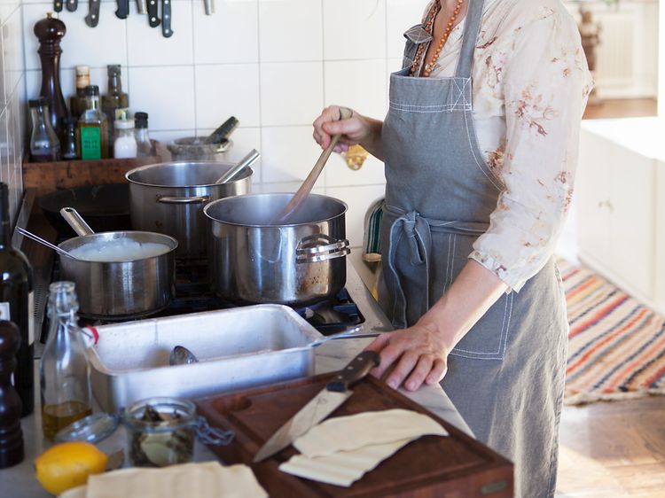 SDA-Cooking-Woman preparing dinner in a kitchen