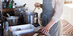SDA-Cooking-Woman preparing dinner in a kitchen