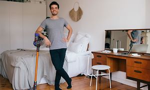 SDA-Vacuum cleaners-Man leaning himself on a hand held vacuum cleaner
