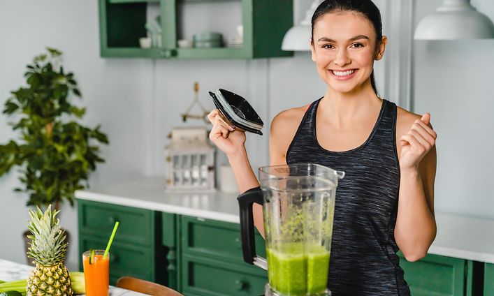 SDA-Kitchen appliances-Woman preparing healthy smoothie-min