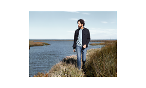 Man walking along a river