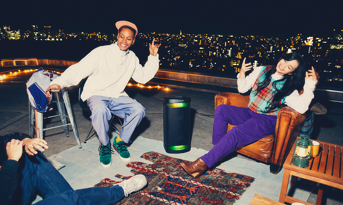 Sony-People on roof with Sony party speaker