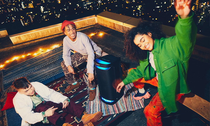 Sony-People dancing on roof with Sony party speaker