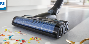 Philips AquaTrio skaftdammsugare som rengör golvet