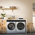 Washing machine and dryer from  Electrolux in a laundry room