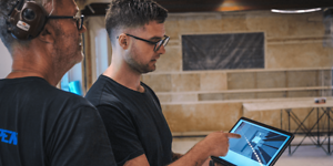 B2B - Do you run a small business - A carpenter showing a collegeau some plans on a tablet Desktop