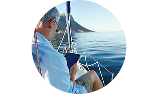 CS - Insurance - Man on a sailing boat with tablet