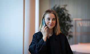 B2B-Woman talking in a phone in a office